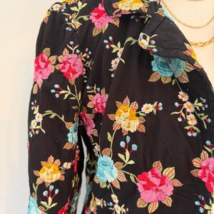 May include: A set of three ceramic mugs with a speckled, matte finish. The mugs are in shades of cream, light gray, and dark gray. Each mug has a simple, modern design and a rounded handle.