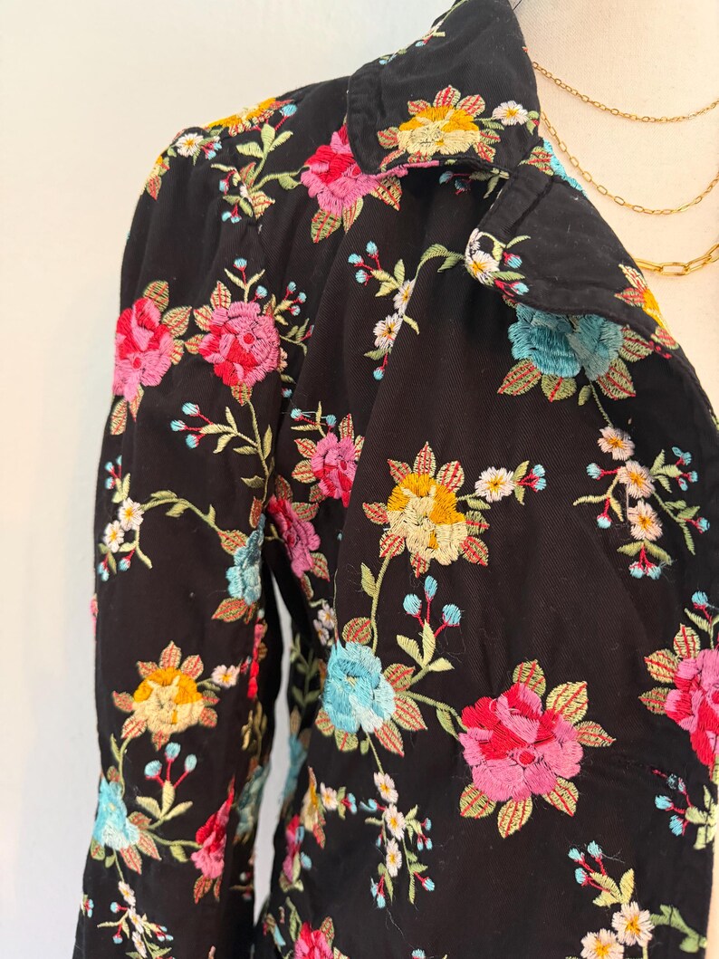 May include: A set of three ceramic mugs with a speckled, matte finish. The mugs are in shades of cream, light gray, and dark gray. Each mug has a simple, modern design and a rounded handle.