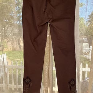 May include: A rectangular wooden sign, distressed for a rustic look, bearing the handwritten text "Welcome to our home". The sign is designed for welcoming guests and can be used indoors or outdoors.