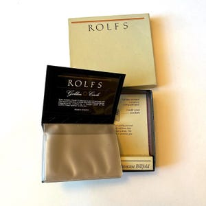 May include: A black leather Rolfs Golden Circle billfold with a credit card pocket and a full-size currency compartment. The billfold is made in America.