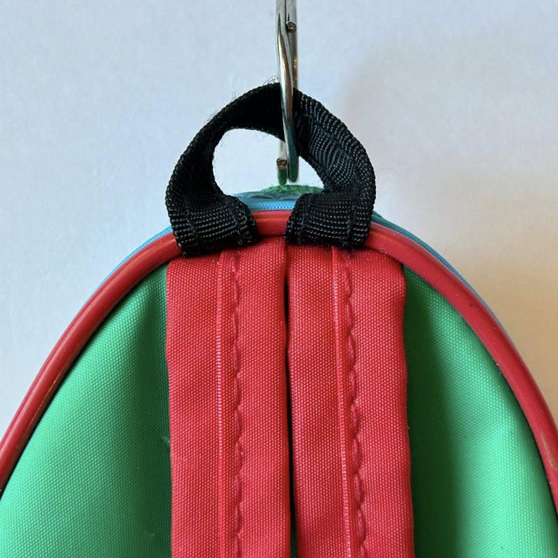 May include: A white ceramic mug with a black handle and the text "But First, Coffee" in a bold, black font. The mug is set against a blurred background, suggesting a cozy setting. The mug appears to be approximately 4 inches tall.