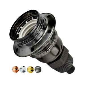 May include: A dark metallic lamp socket featuring a threaded exterior, a white interior ceramic component, and a wide circular flange with small holes. The base is marked with 3/4-1/4 text. Four small circular colour swatches appear below.