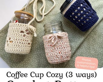 May include: Three glass jars with crochet cozies. One cream cozy has a long strap, one is solid cream with a tie, and one is dark blue with a grid pattern. Text reads: Aurora & Jack Designs, Coffee Cup Cozy (3 ways) Crochet Pattern.