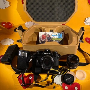 Vintage Nikon EM 35mm SLR Single Lens Reflex All Black Film Camera With 50mm f/1.8 E Series Lens + Nikon 100mm f/2.8 E Series Lens