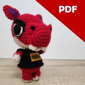 May include: Crocheted red dinosaur plush toy with black and white clothing. The dinosaur has a purple nose and white teeth.