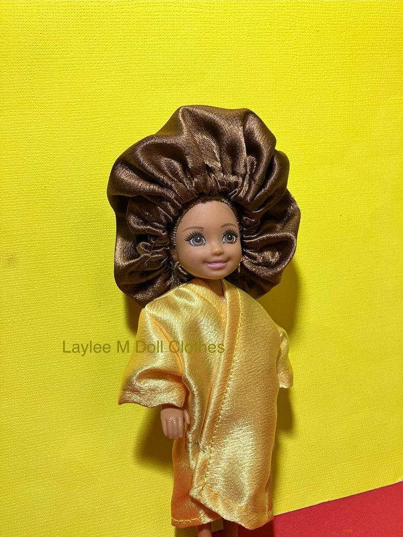 Doll Clothes -  Little Doll Bonnets   by Laylee M Doll Clothes- Free shipping in USA
Single Little Bonnets $9.99
Fits Chelsea Doll
Robes Matching Bonnet Yellow Sets $16.99