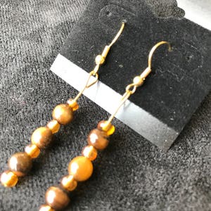 Brown Spheres with Yellow Spacer Earrings
