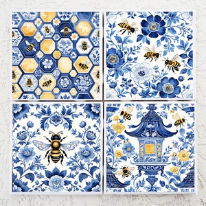 May include: Set of four blue and white ceramic coasters with a bee and floral design. The coasters feature a variety of patterns, including bees in a honeycomb, bees in a floral garden, and bees in a pagoda.