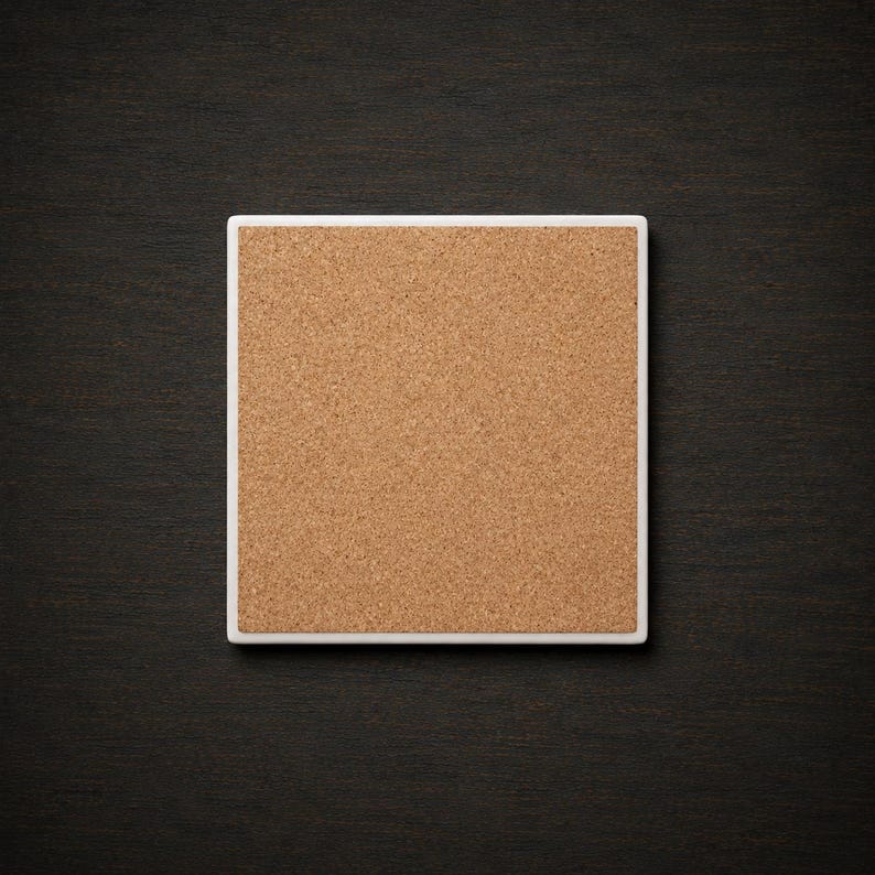 May include: A square coaster featuring a natural light brown cork surface set within a clean white border. The coaster has a flat, uniform texture and a simple geometric shape, providing a neutral base for various types of drinkware and containers.