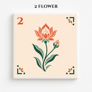 May include: Square ceramic tile with a floral design. The tile features a stylized orange flower with green leaves and a bud on a cream background. The number "2" is in orange at the top left, and the text "2 FLOWER" is at the top. Decorative corner elements are in green and orange.