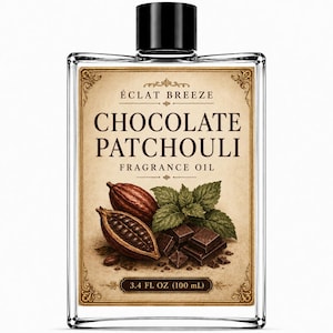 May include: A clear glass bottle of Eclat Breeze Chocolate Patchouli fragrance oil with a black cap. The label features the text Chocolate Patchouli Fragrance Oil, illustrations of cocoa pods, chocolate squares, and green leaves, and 3.4 FL OZ.