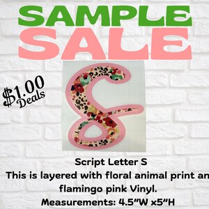 May include: A script letter "S" with a floral animal print design and flamingo pink vinyl. The letter measures 4.5 inches wide and 5 inches high. The image also includes the text "SAMPLE SALE" and "$1.00 Deals".