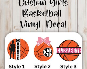 May include: Custom girls basketball vinyl decal designs. Three styles are shown: a silhouette of a girl with a basketball, a basketball with a pink bow and initials, and a basketball with a name in pink.