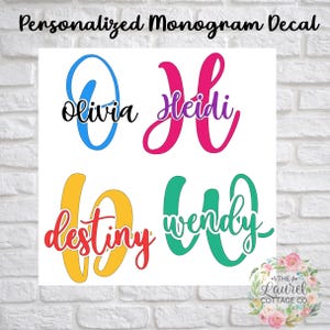 May include: Four personalized monogram decals featuring names in script font overlaid on large capital letters. The names Olivia, Heidi, Destiny, and Wendy are displayed in black, purple, red, and green, respectively, against blue, pink, yellow, and teal letters.