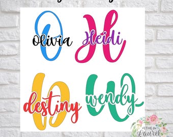 May include: Four personalized monogram decals featuring names in script font overlaid on large capital letters. The names Olivia, Heidi, Destiny, and Wendy are displayed in black, purple, red, and green, respectively, against blue, pink, yellow, and teal letters.