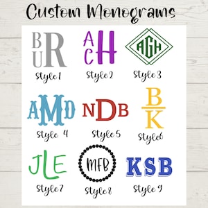 May include: A collection of custom monogram designs in various styles and colors. The image features nine different monogram options, each with a unique font and color scheme. Text at the top reads "Custom Monograms".