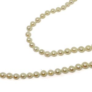Pearl necklace with saltwater cultured pearls and antique silver fish hook closure with pearl. ca. 1960