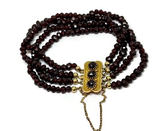 Garnet 4 strand bracelet with 14k box clasp and safety chain.  Dutch antique folkloric jewelry.