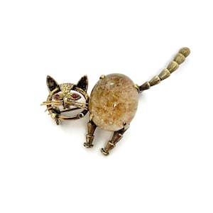 Cat brooch with natural rutile quarts gemstone. Red ruby eyes. Beautiful vintage brooch