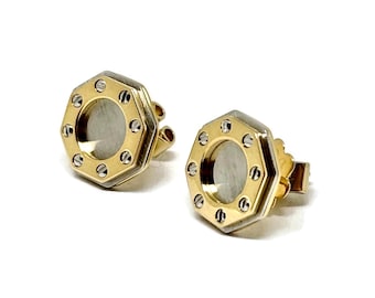 Cartier-Ohrringe Santos, ca. 1980er Jahre, 18 Karat Gold, Cartier-Punze. Or et Acier: Ohrringe aus Gold und Stahl.