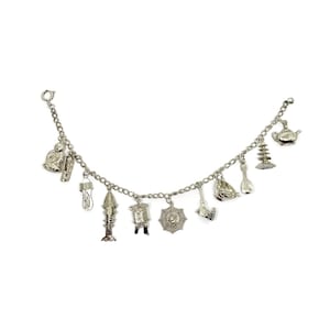 Chinese charm bracelet. Silver Chinese hallmarked bracelet Pagoda, Articulated fish, Lantern, Spider web, Buddha, wok charm.