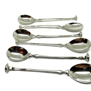 Set med 6 'Frisiska lockar' eller violinlockar. Skedar i sterling silver. Stämplat holländskt silver.
