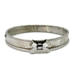 Bow hinged bangle bracelet with lovely small beaded edge. Sterling silver hallmarked