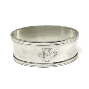 Silver Oval Napkin ring with fillet edge. Engraved Monogram F C