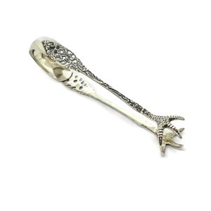 Rococo Sugar tongs with turkey claws. Silver hallmarked Amsterdam 1939
