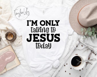 May include: White t-shirt with black text that reads "I'm only talking to Jesus today".