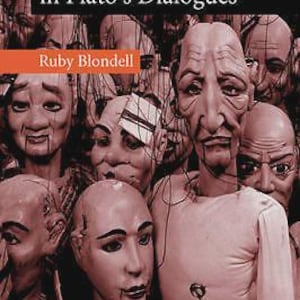 May include: Book cover titled "The Play of Character in Plato's Dialogues" by Ruby Blondell. The cover features a sepia-toned image of several puppet heads with detailed facial features. The Cambridge logo is in the bottom right corner.