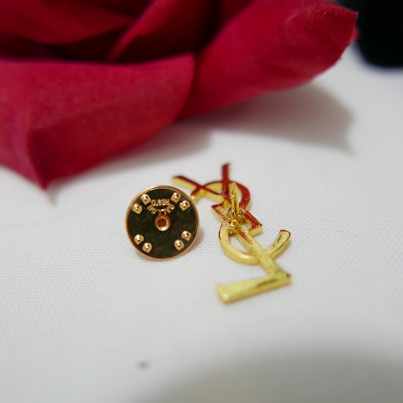 ブローチ・コサージュ SAINT LAURENT YSL BROOCHE PIN SAINT LAURENT Gold-tone brooch | NET-A-PORTER