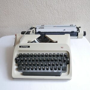 Triumpf Adler Sheidegger Germany Mechanical Typewriter in Beige with case 1960s image 3