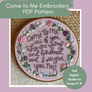 May include: A pink embroidery hoop with the text "Come to Me" and a floral design. The text is in a cursive font. The hoop is surrounded by a wooden frame. The image also includes the text "Full Digital Guide for hoops 5"-8".