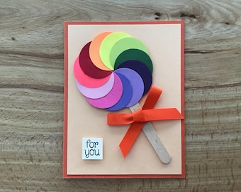 Rainbow  lollipop Happy Birthday card: raised die cut paper lollipop, wood stick, and ribbon bow