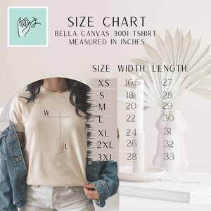 May include: Size chart for Bella Canvas 3001 t-shirt, measured in inches. The chart shows the width and length of the shirt in inches for sizes XS to 3XL.
