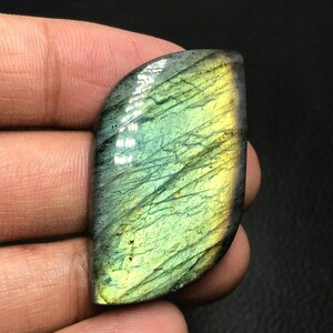 Multi Flash labradoriet cabochon... Freeform cabochon...42 x 23 x 7 mm... 60 cts...#J2989