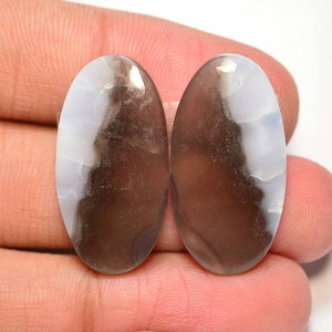 Par de cabujones de ópalo azul Owyhee... Par de cabujones de ópalo azul... Cabujones ovalados... 27x14x5mm....31Cts..#H8660