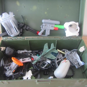 Hasbro Action man box with mixed action figures accessories. Vintage play adventure toys.