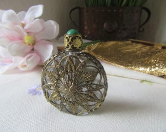 Cased glass perfume bottle, ornate gold tone case, glass bottle, screw top  green stone, glass dibber attached .