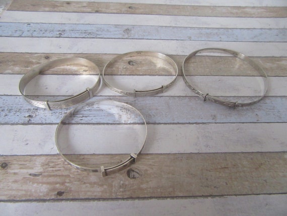 Choice of 4 silver adjustable bangles, bracelets.… - image 1
