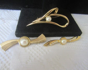 Goldtone metal brooches set of 3  with faux pearls and rhinestones.