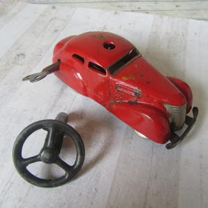 Vintage Schuco 3000 metal car with wheel. Telesteering red car. Collectible Schuco toy clockwork car. Working. 4&quot;  10cm.