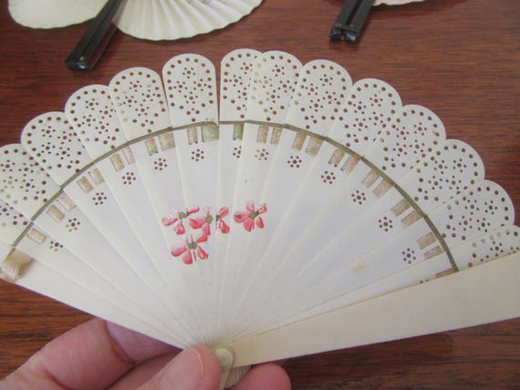 Vintage collection of folding hand fans. Choice of 3. Plastic with tag. Peoples republic of china orange blossom.  Pink- parrots & blossom.