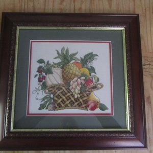 Still life fruit basket completed and framed cross stitch picture, designed by Linda Jary.  Home office wall decoration.