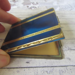 c1920s Art Deco blue enamel and gilt powder compact. Rare collectible. Marbled effect enamel. Rare opening clip.