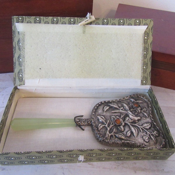 Vintage Oriental Jade handle mirror. Silver plated handheld mirror in original box.. Ornate mirror with bird, foliage & 2 orange cabachons.
