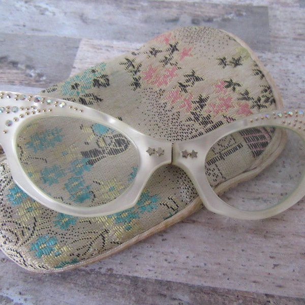 Vintage Cat eye  Lorgnette folding opera glasses in a Japanese scene material bag. Creamy white lucite frame with Aurora Borealis crystals.