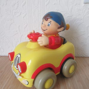 ビンテージのノディカーを押して遊ぶおもちゃ。