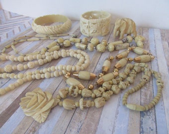 Vintage collection of bone jewelery. Bracelet bangle  4 x necklaces and a elephant ornament.